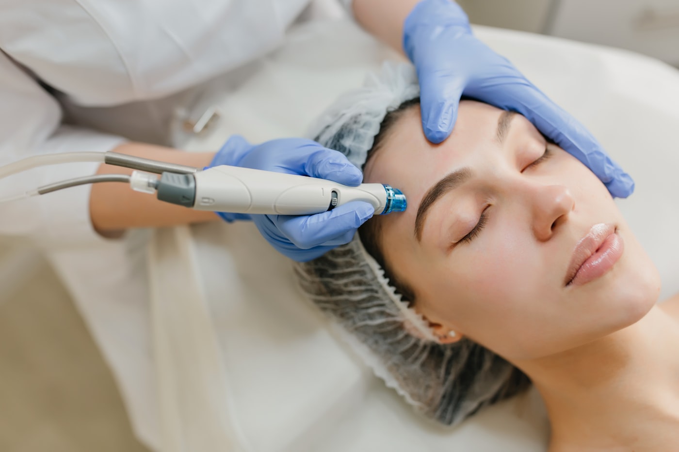 Clinician performing a facial aesthetic treatment